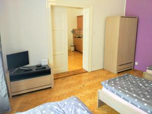 Postel nebo postele na pokoji v ubytování Apartments Týnská 7