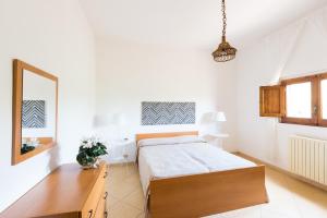 Een bed of bedden in een kamer bij Casa Mediterranea dei Normanni
