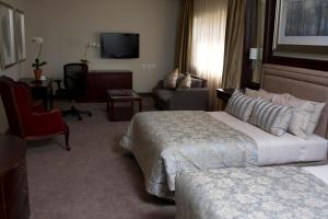 Postel nebo postele na pokoji v ubytování Apollo Hotel