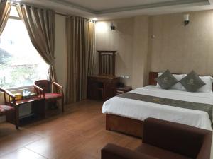 Giường trong phòng chung tại Chio Hotel