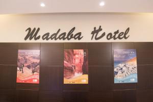 a sign for a wadiida hotel in a building at Madaba Hotel in Madaba