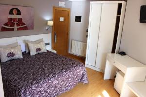 Кровать или кровати в номере Hotel Las Olas