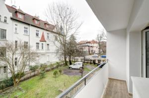 a balcony with a view of a street at DR Apartments - Five in Sopot