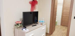En tv och/eller ett underhållningssystem på Cristallo Camere