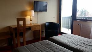 Postel nebo postele na pokoji v ubytování Hostellerie Reeb