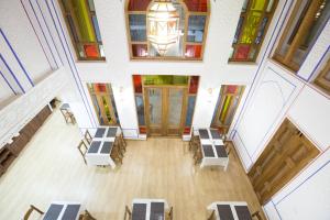 an overhead view of a hall with tables and chairs at Hotel Volida Boutique in Bukhara