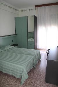 Postel nebo postele na pokoji v ubytování Hotel Palm Beach