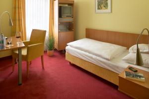 Postel nebo postele na pokoji v ubytování Hotel Mehl