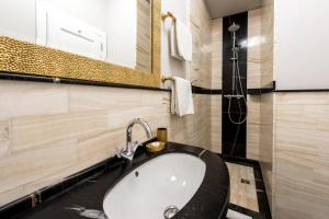 a bathroom with a sink and a mirror at Dominus Little Palace in Dubrovnik