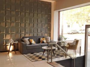 a living room with a couch and a table at Hotel Central in Durazno