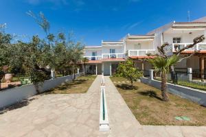 a bowling alley in front of a house at Gerakini Sunshine Holiday Homes in Yerakiní