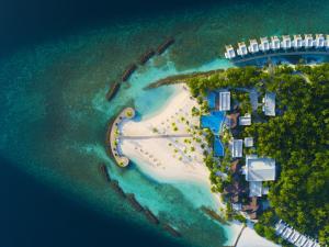 an aerial view of a resort in the ocean at Dhigali Maldives - A Premium All-Inclusive Resort in Raa Atoll