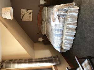 a bedroom with a bunk bed in the attic at Greannan Upper Self Catering Apartment in Blackwaterfoot