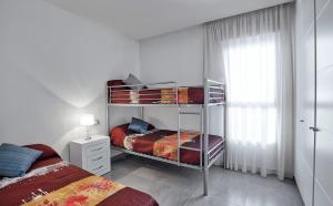 A bed or beds in a room at La Reserva Puerto Banus