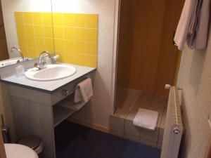 Koupelna v ubytování Le CESAR HOTEL