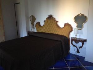 Postel nebo postele na pokoji v ubytování B&B Amendola
