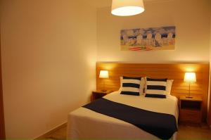 Ένα ή περισσότερα κρεβάτια σε δωμάτιο στο Apartamentos Mare +30 φωτογραφίες