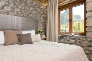 Posteľ alebo postele v izbe v ubytovaní Tsikeli Boutique Hotel Meteora - Adults Friendly