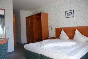 Postel nebo postele na pokoji v ubytování Hotel Tannerhof