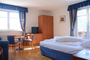 Postel nebo postele na pokoji v ubytování Hotel Tannerhof