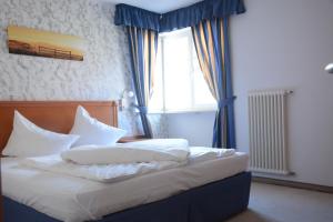Postel nebo postele na pokoji v ubytování Hotel Tannerhof