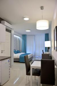 Łóżko lub łóżka w pokoju w obiekcie JessApart – Ochota Apartments
