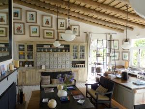 a kitchen with wooden cabinets and a table and chairs at Casa Anna in Garzón