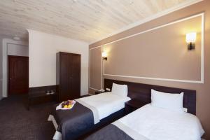 Ein Bett oder Betten in einem Zimmer der Unterkunft Geneva Resort Hotel