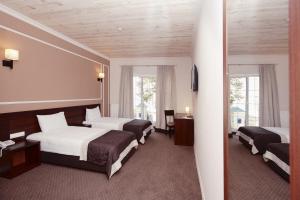 Postel nebo postele na pokoji v ubytování Geneva Resort Hotel + 23 fotografií