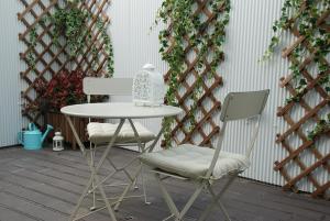 a table and two chairs on a patio at OportoView Premium Apartment in Porto