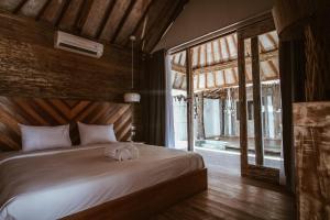 Tempat tidur dalam kamar di Camilla Resort