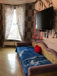 Televízia a/alebo spoločenská miestnosť v ubytovaní Guest House Belaya Nevestochka
