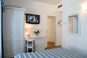 Postel nebo postele na pokoji v ubytování Hotel La Goletta + 25 fotografií