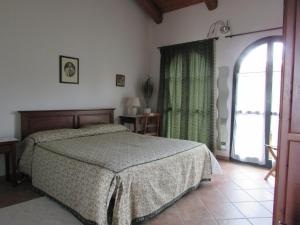 Postel nebo postele na pokoji v ubytování Agriturismo Cascina Barin