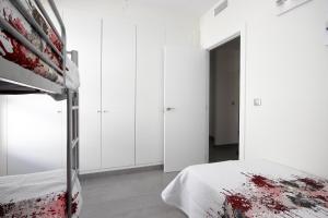 A bed or beds in a room at La Reserva Puerto Banus