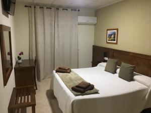 Postel nebo postele na pokoji v ubytování Hotel Don Juan