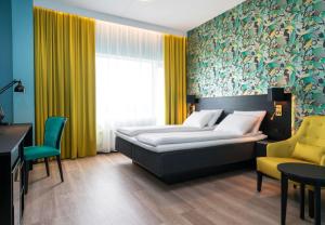 Postel nebo postele na pokoji v ubytování Thon Hotel Arena