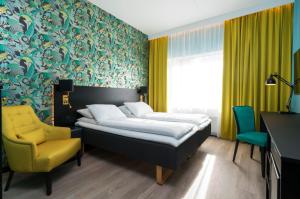 Postel nebo postele na pokoji v ubytování Thon Hotel Arena