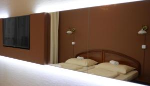 A bed or beds in a room at Hotel Minerva