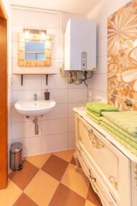 a bathroom with a sink and a mirror and a sink at Apartment Sirius E in center of CB in České Budějovice
