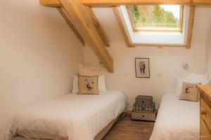 Postel nebo postele na pokoji v ubytování La Ferme du Nol