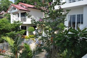 a view of the front of a house with plants at Da Bungalows in Kata Beach