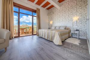 Кровать или кровати в номере Dulce Nombre Hotel - Apartamentos