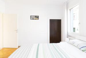A bed or beds in a room at Bella Vita Charming House