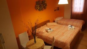 Postel nebo postele na pokoji v ubytování Oasi B&B
