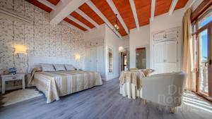 Кровать или кровати в номере Dulce Nombre Hotel - Apartamentos