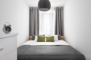 Posteľ alebo postele v izbe v ubytovaní Halna Residence