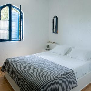 Tempat tidur dalam kamar di Villa Ippocampi - Adults Only