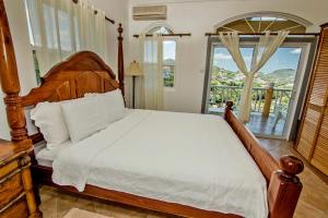 Postel nebo postele na pokoji v ubytování Paradise Cove