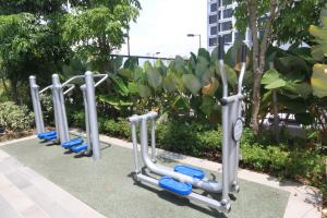 a row of exercise machines lined up in a row at Centrus Soho Cyberjaya by IdealHub in Cyberjaya